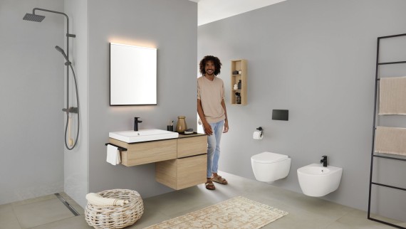 Man looking pleased in a bathroom Man looking pleased in a bathroom