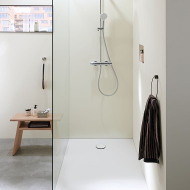 A walk-in shower in a small bathroom