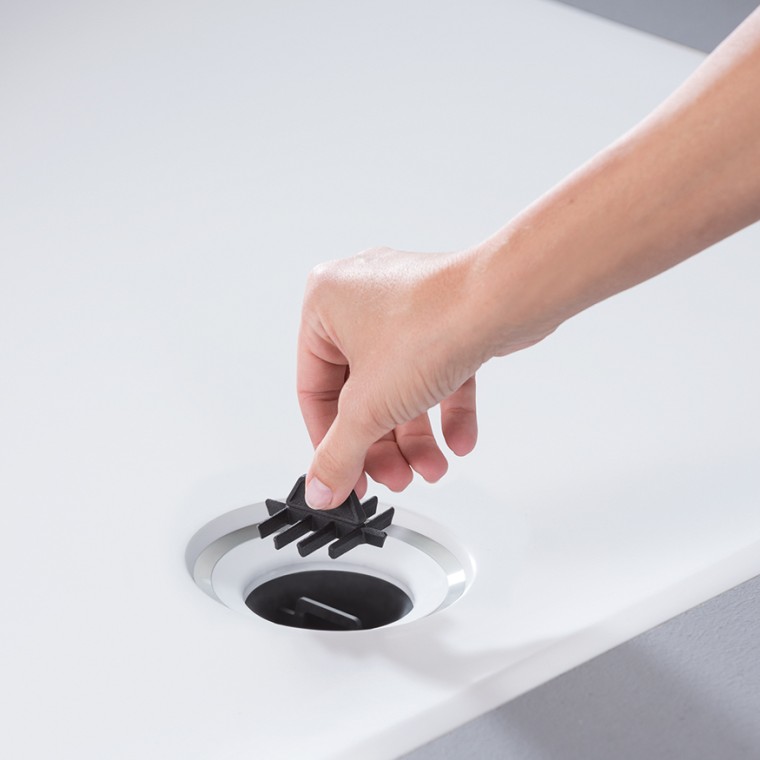 Hair catcher integrated into the drain of the Geberit Setaplano shower surface