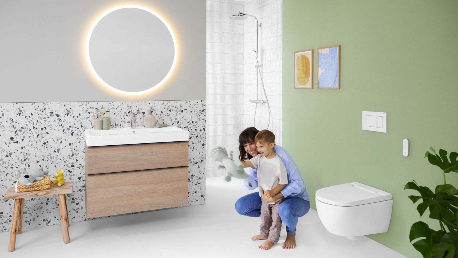 Geberit AquaClean Alba with woman and child in the bathroom