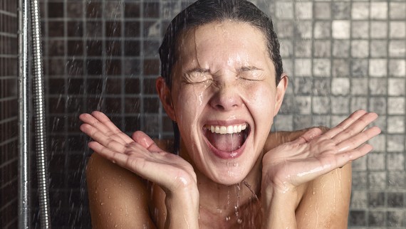 Woman freezing in the shower