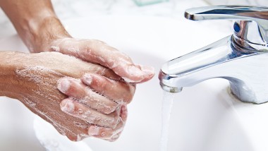 Washing hands in the washbasin
