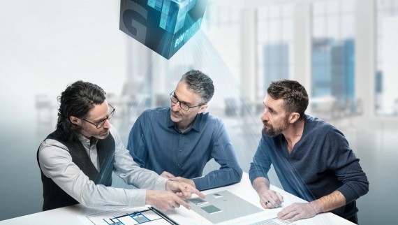 Planners deep in discussion around a table with BIM symbol Planners deep in discussion around a table with BIM symbol